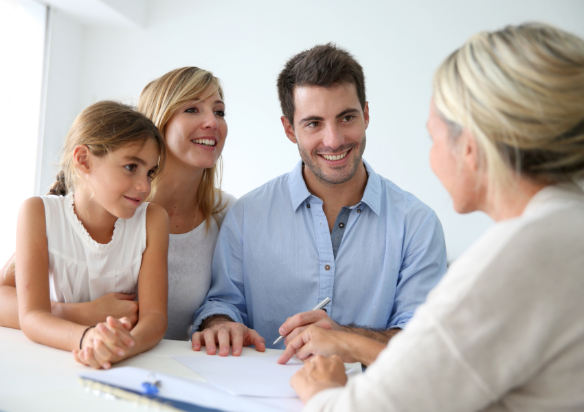 Young family discussing plans with advisor.